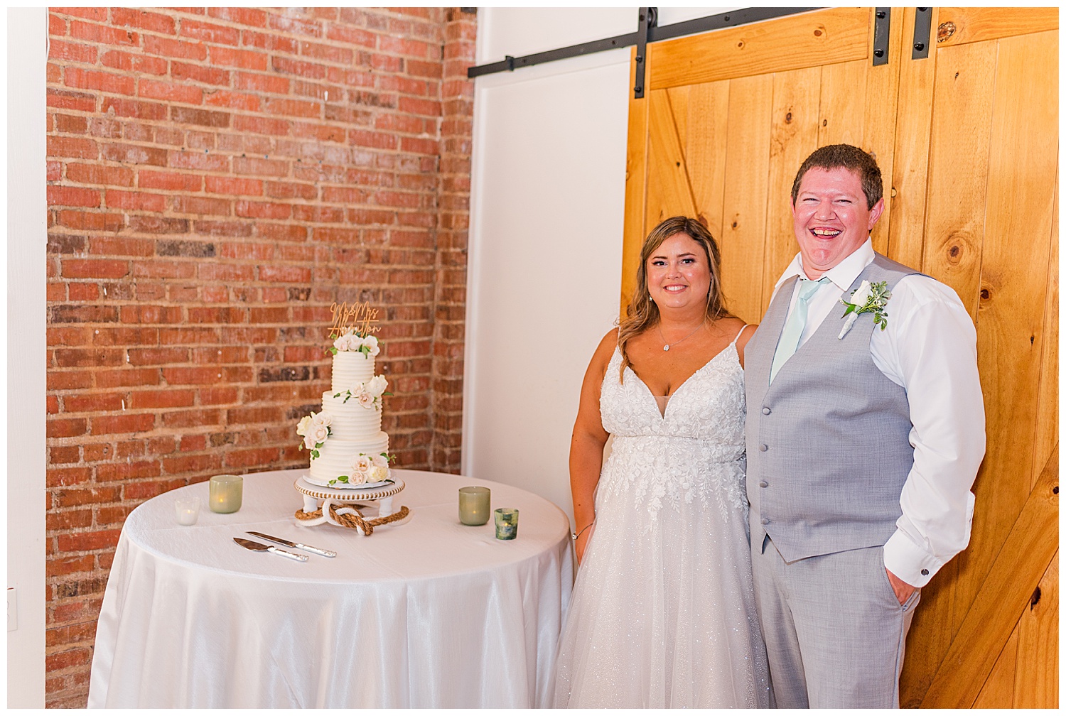 bride and groom cutting the cake at The River Room wedding venue
