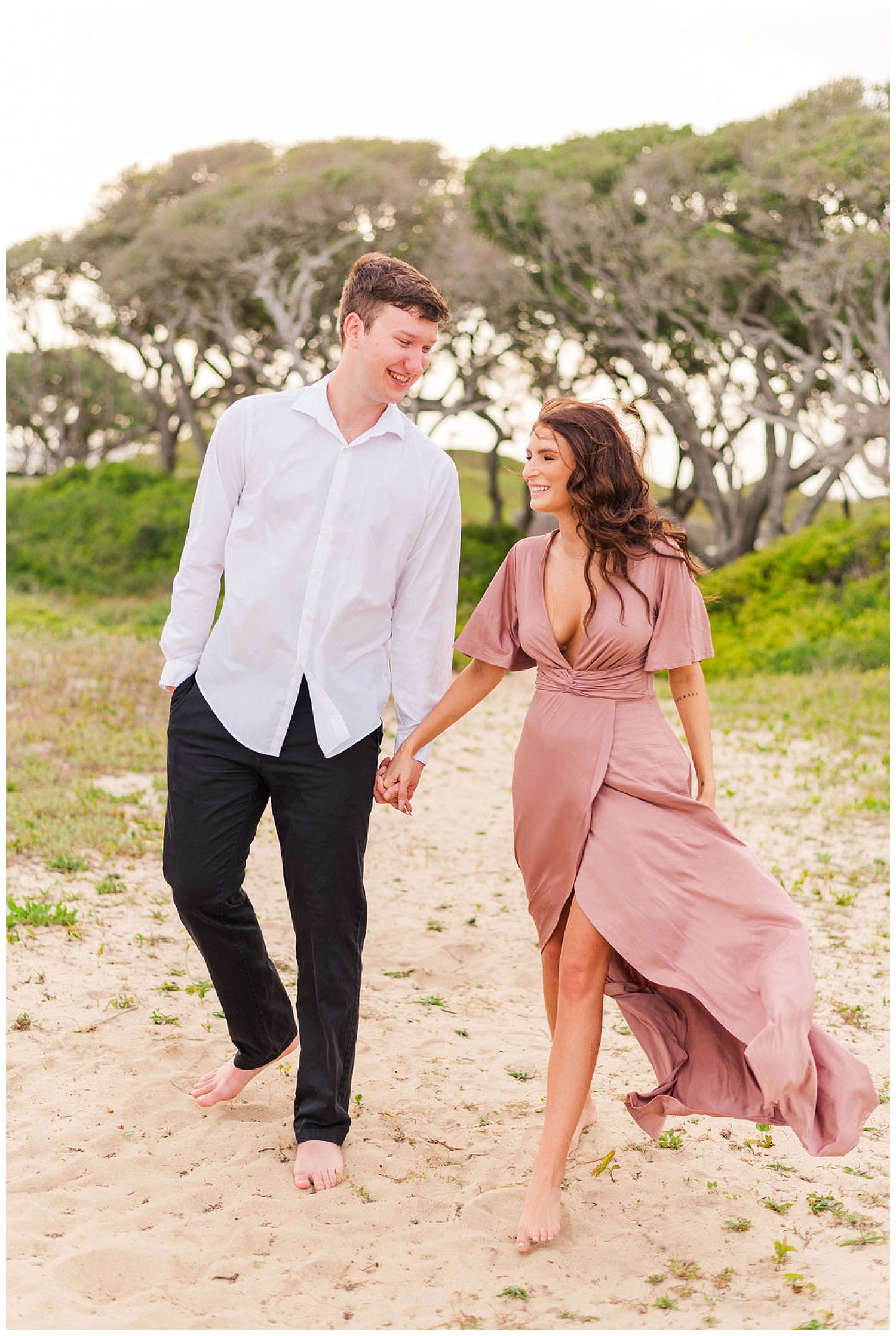 couple walking together at Kure Beach engagement session