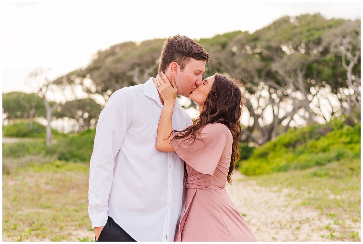 couple kissing at Fort Fisher engagement session