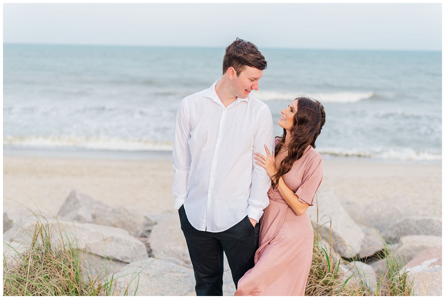 couple standing together on Kure Beach at engagement session