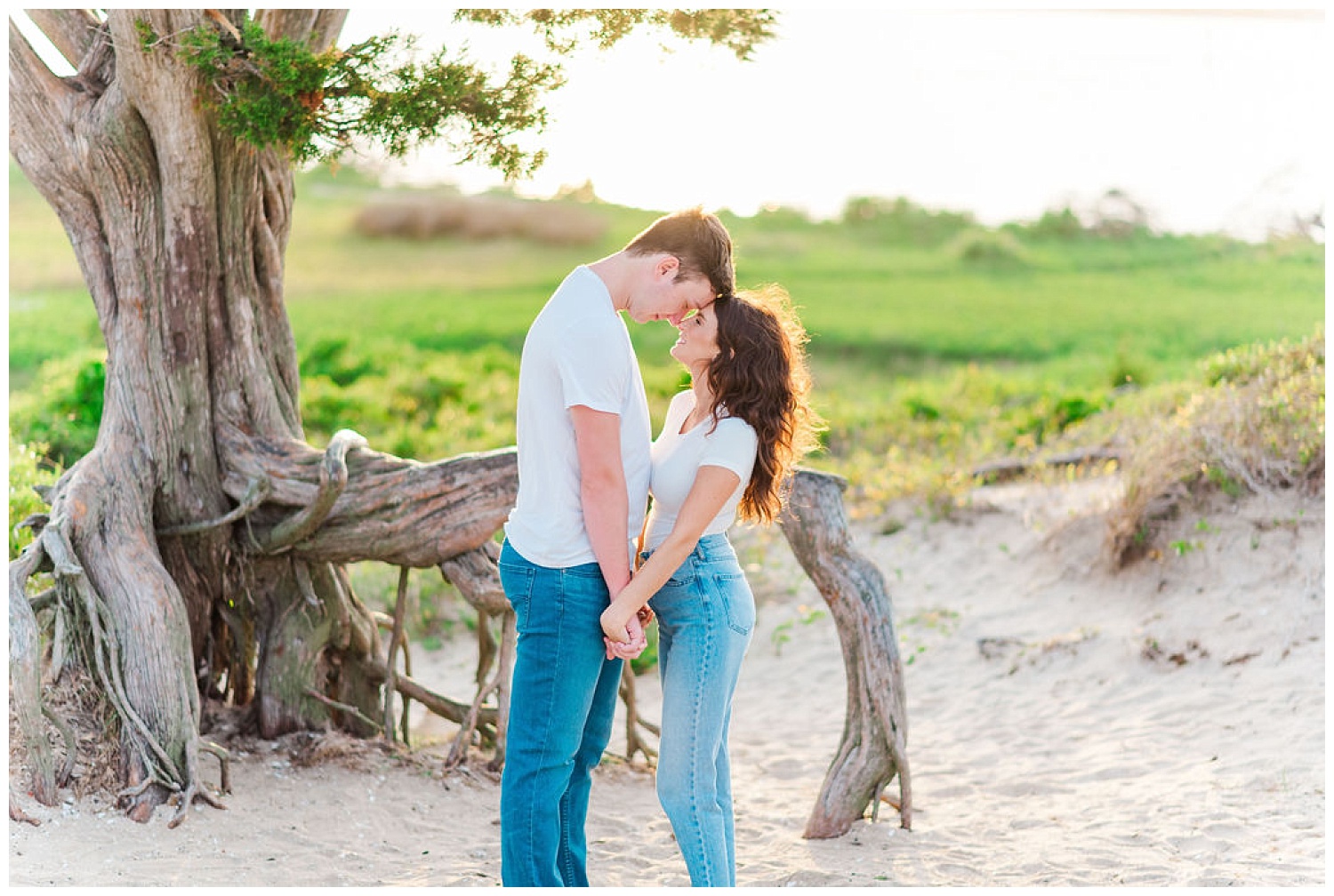 couple touching foreheads at Kure Beach engagement session