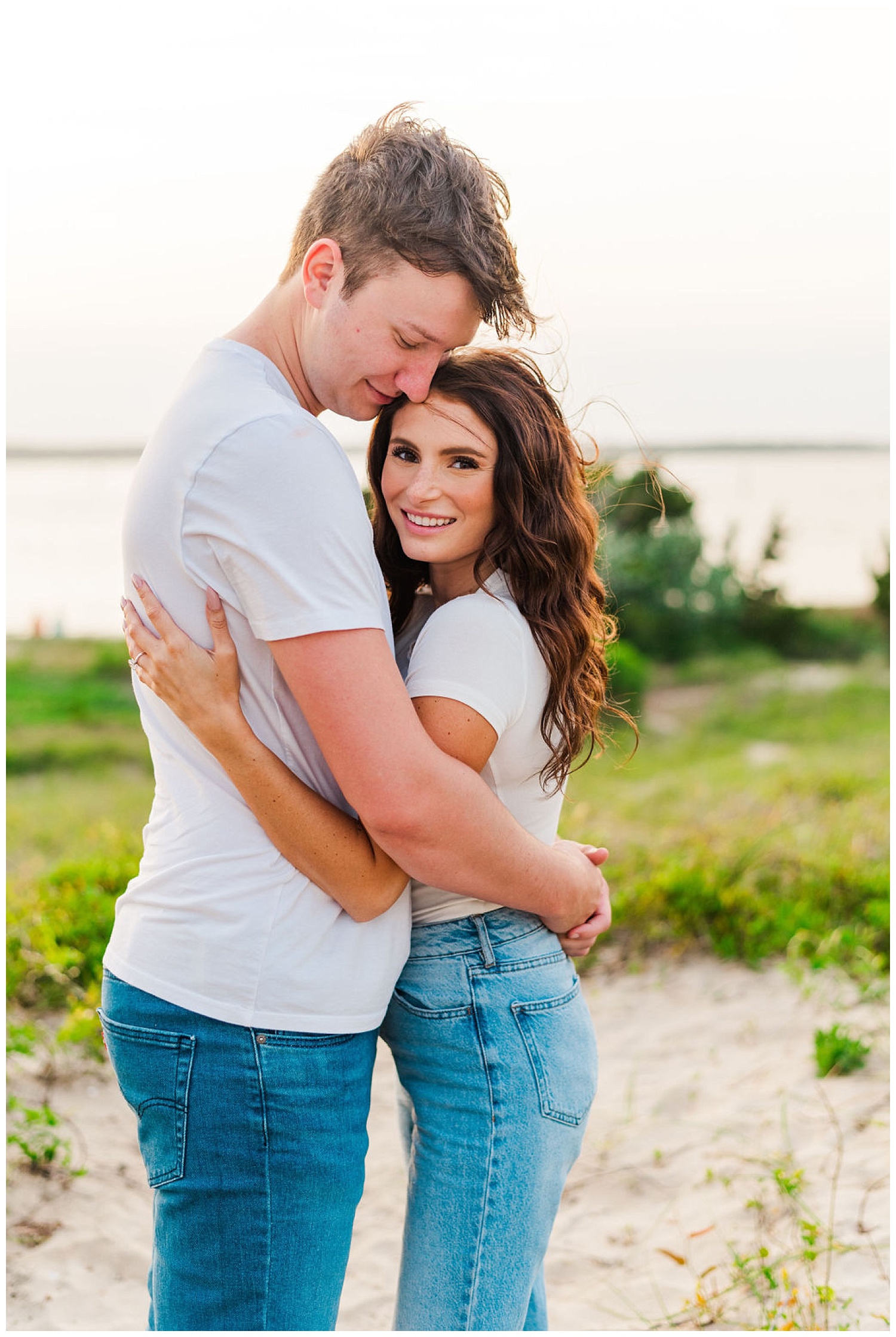 couple hugging each other at North Carolina beach engagement session