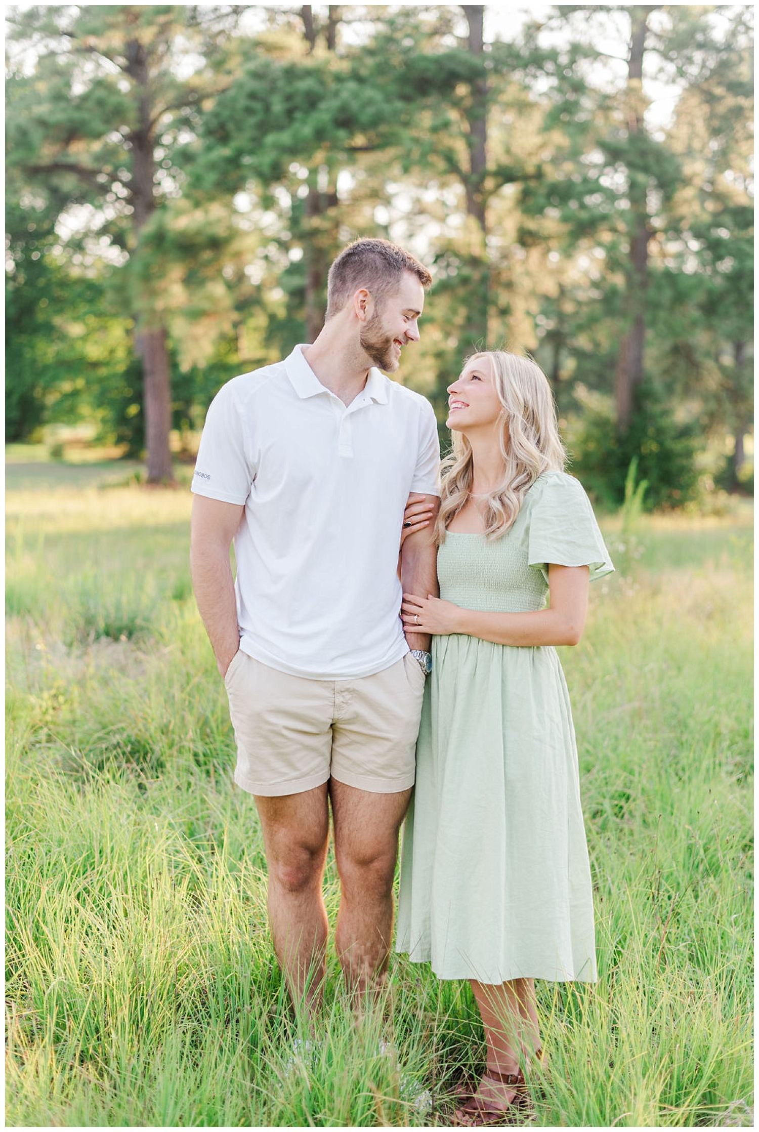 engaged couple smiling at each other in North Carolina