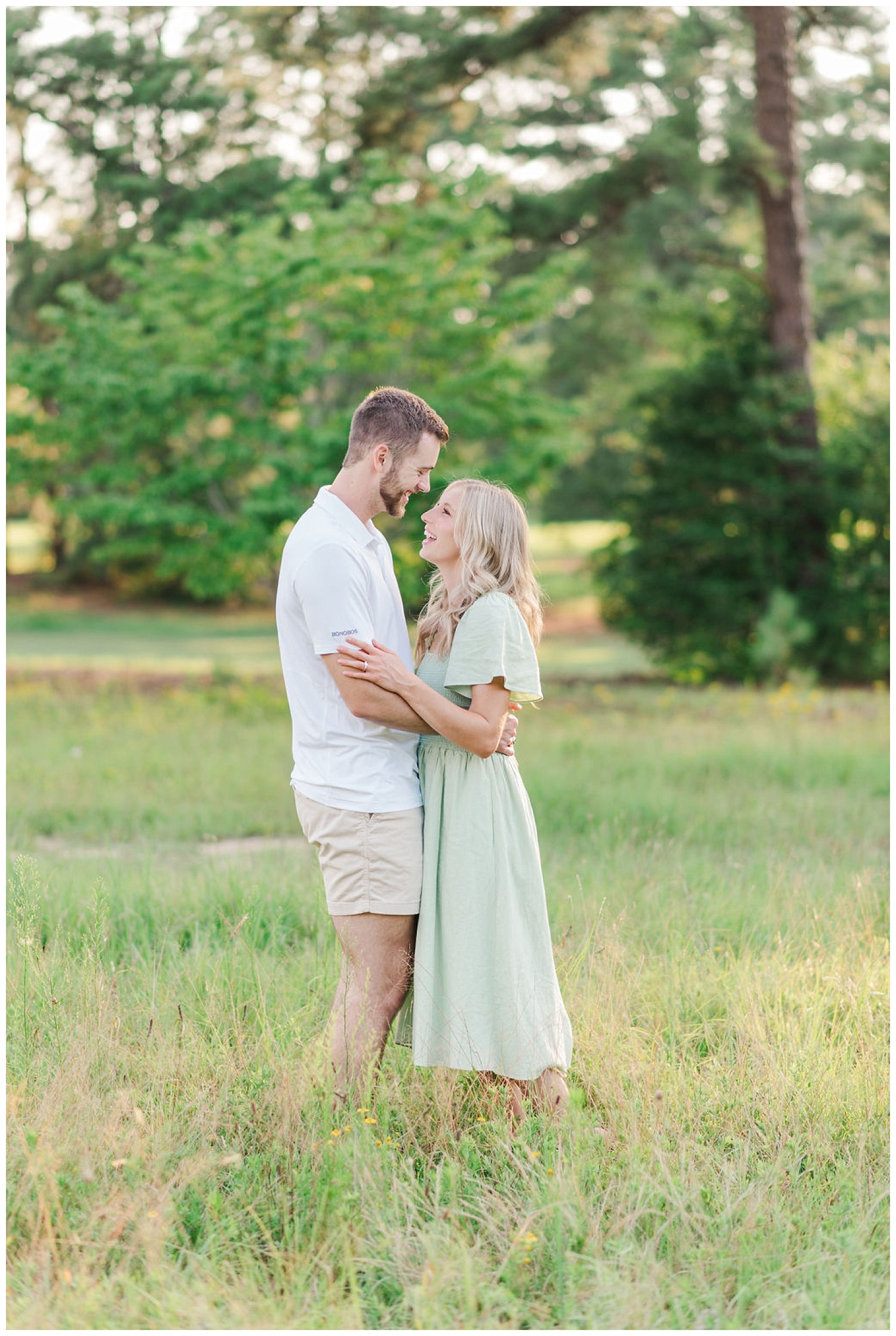 couple laughing together at Lake Gaston engagement session