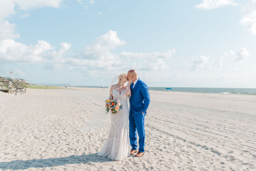 wedding couple kissing on the beach in Wilmington, NC