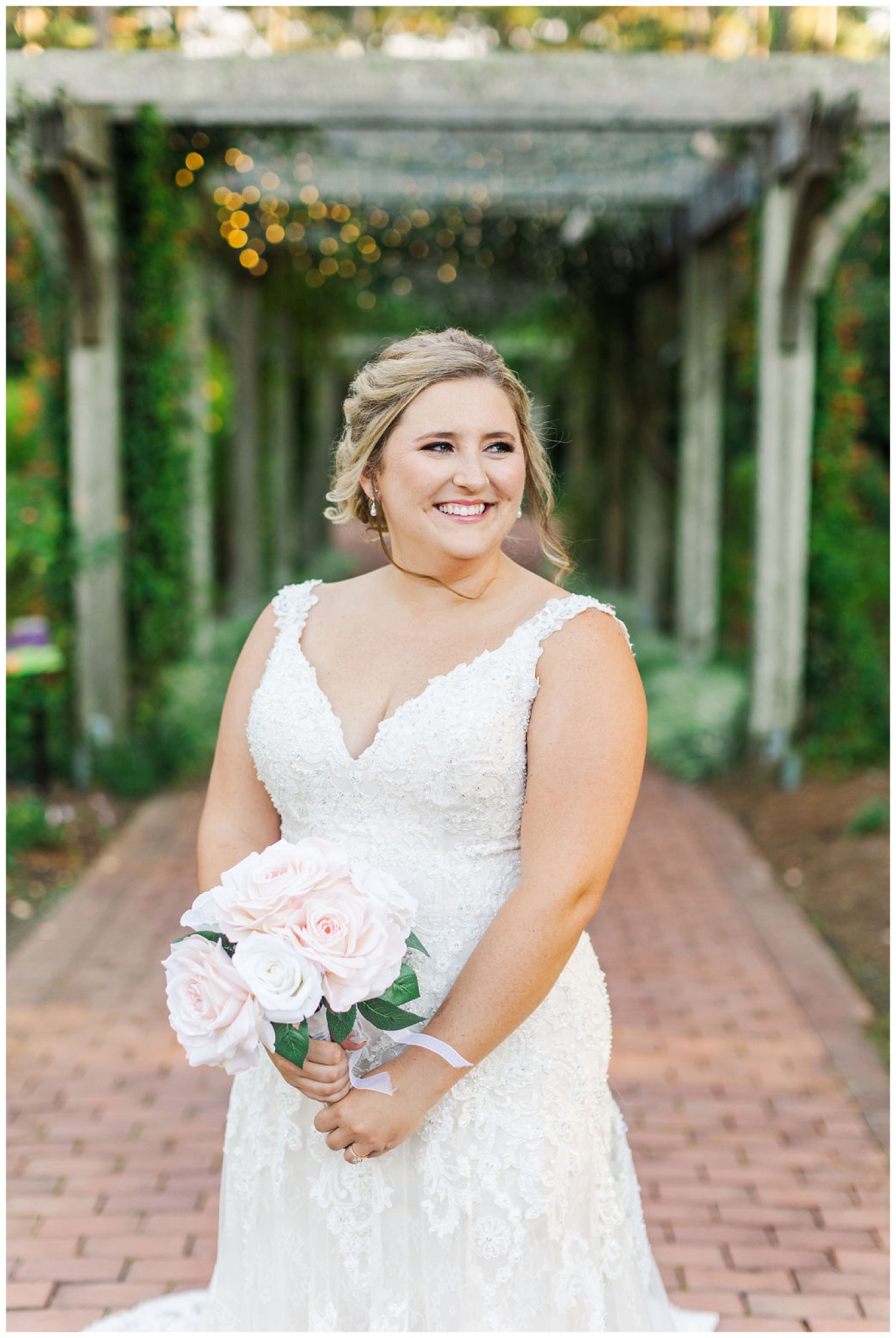 bride standing in front of a pergola at a bridal session at Cape Fear Botanical Gardens
