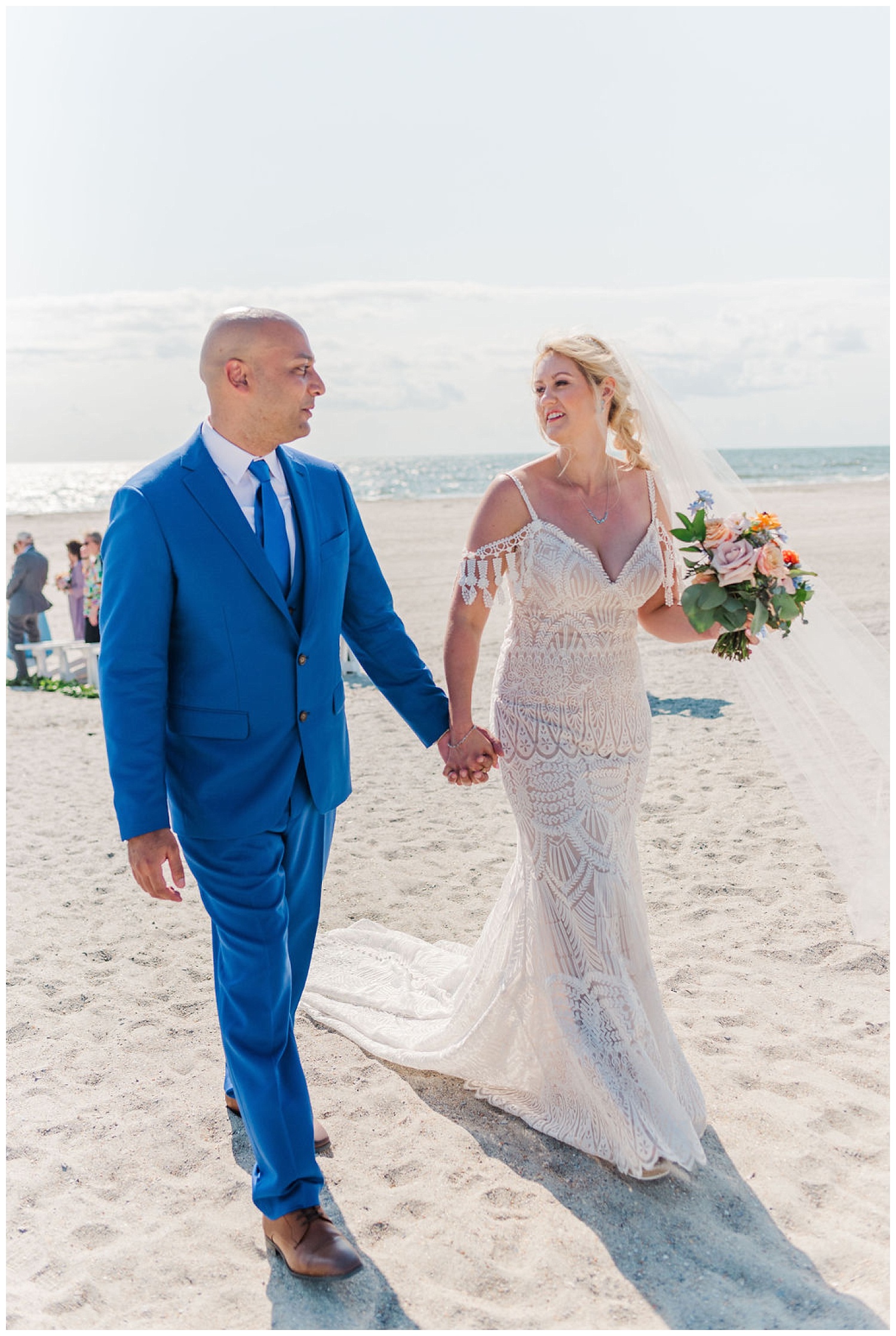 bride and groom walking back down the aisle at wedding on Carolina Beach