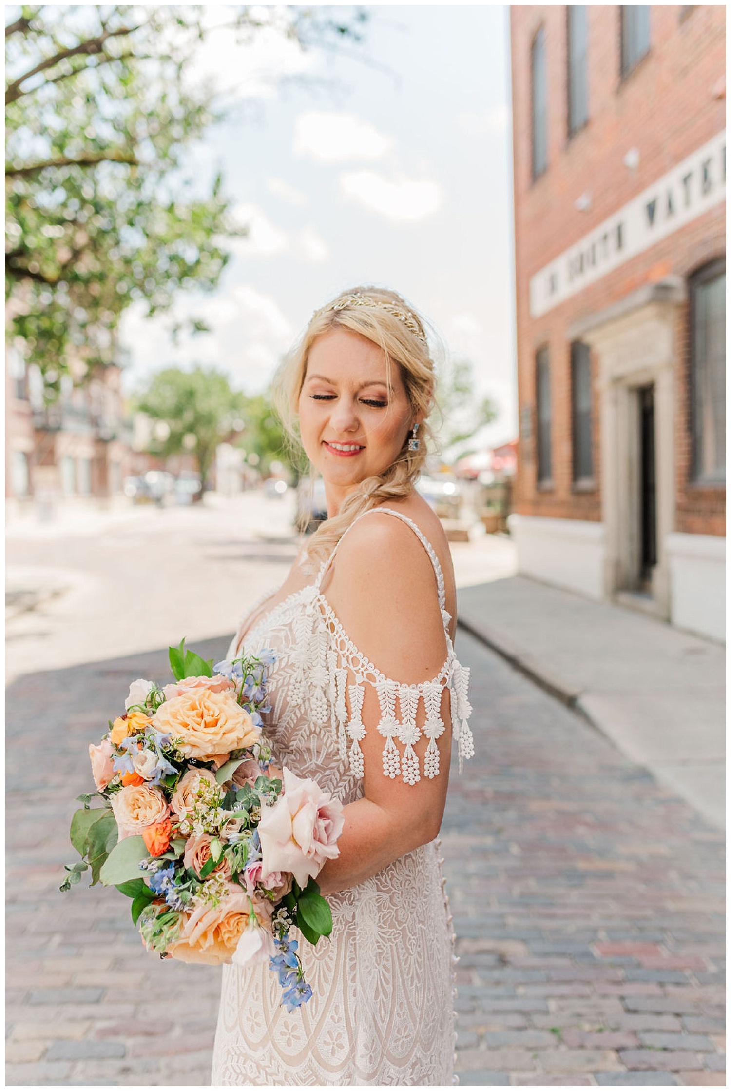 profile pose of a bride and her bouquet standing on the street in Wilmington