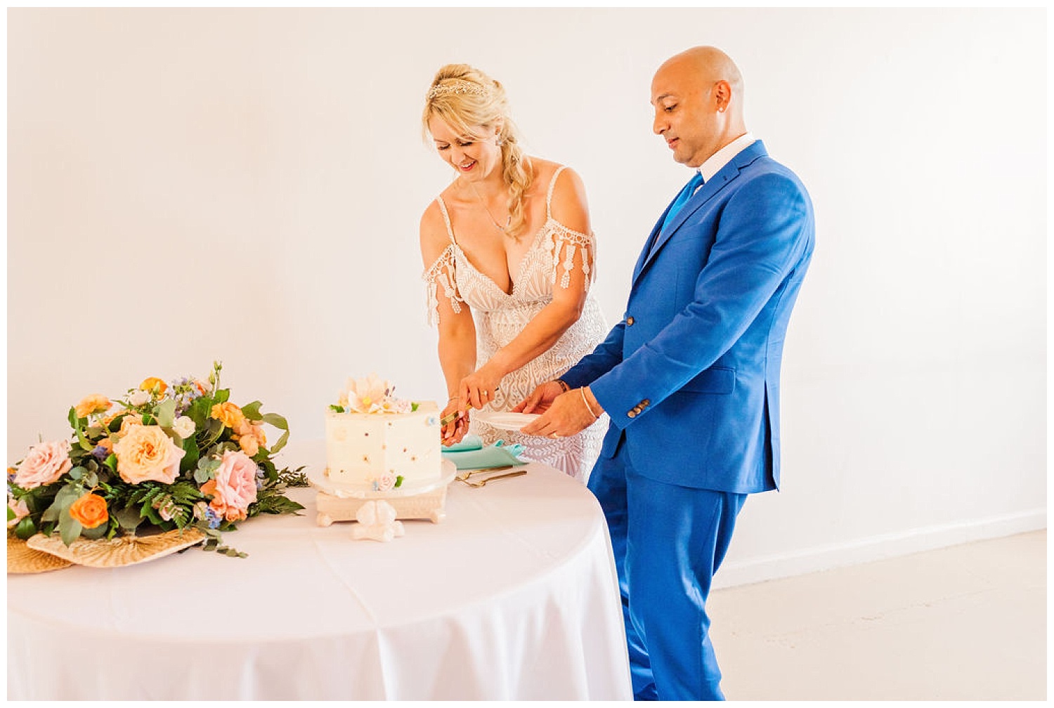 wedding couple cutting the cake at the River Room