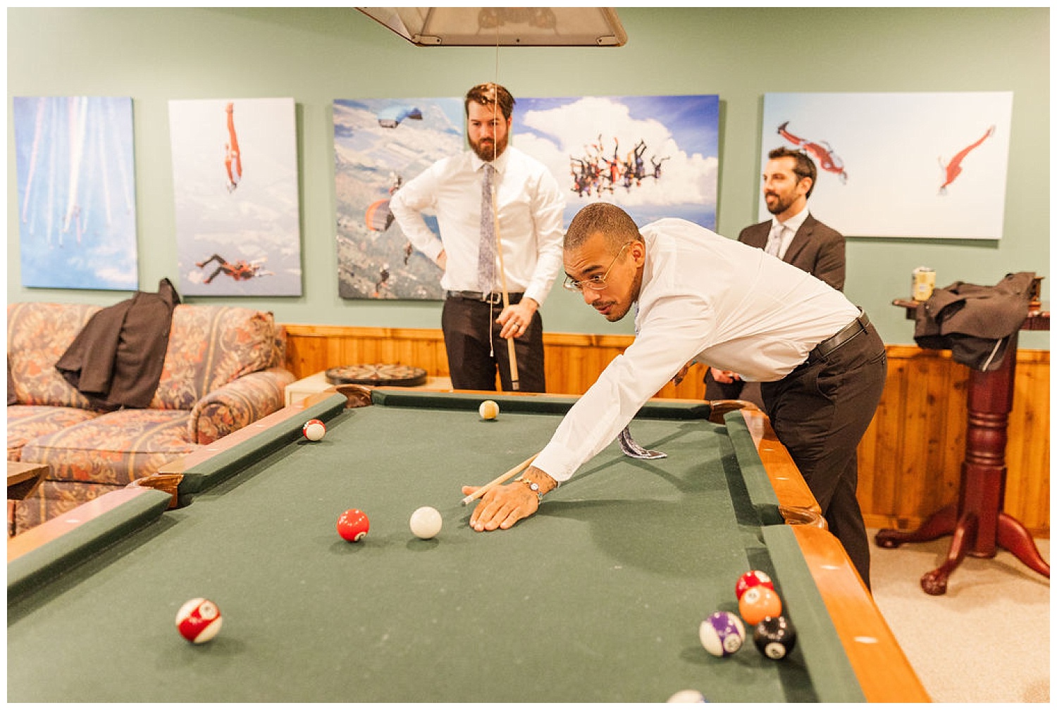 groomsmen playing pool while getting ready