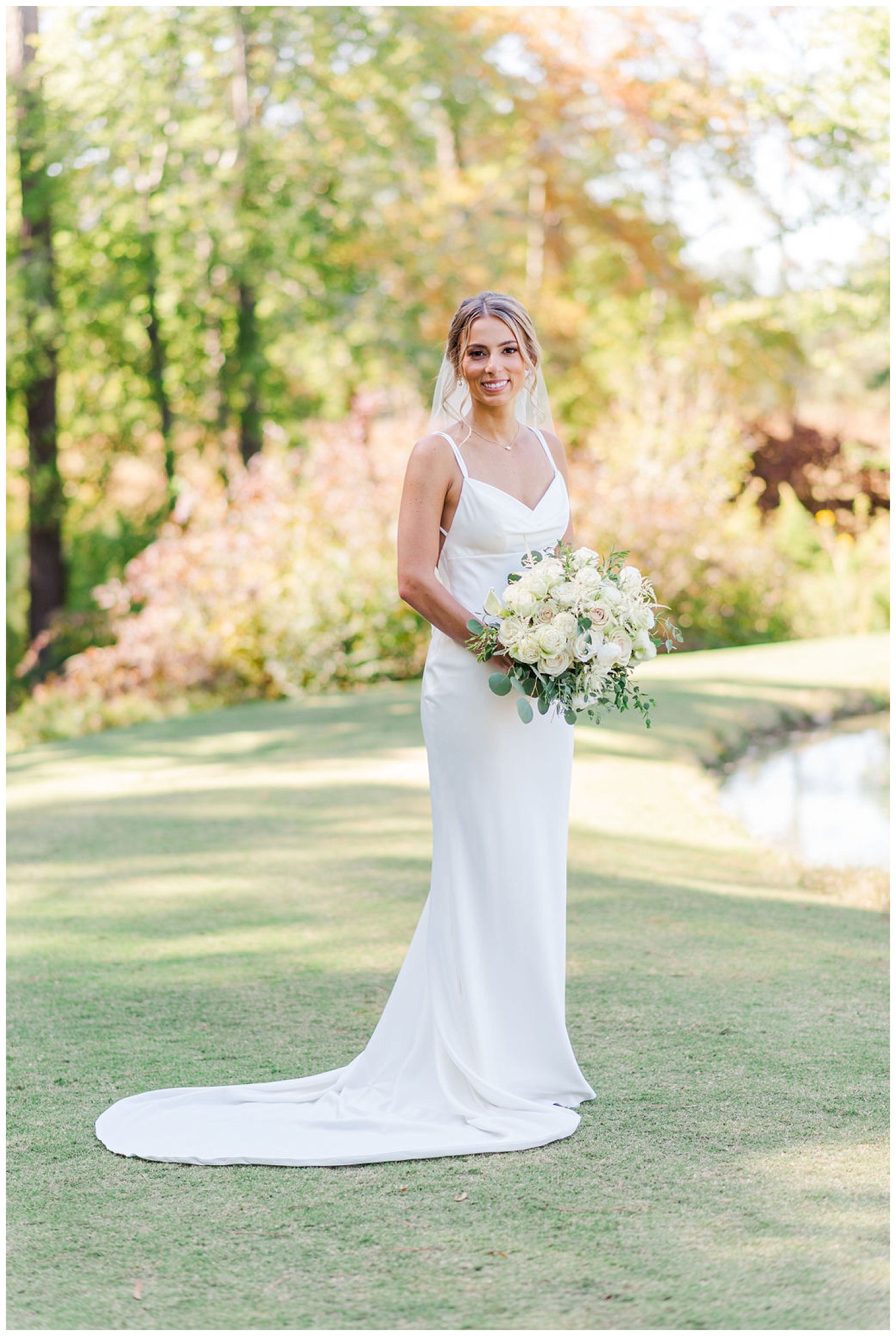 bride walking next to a pond at the Chapel Hill Carriage House