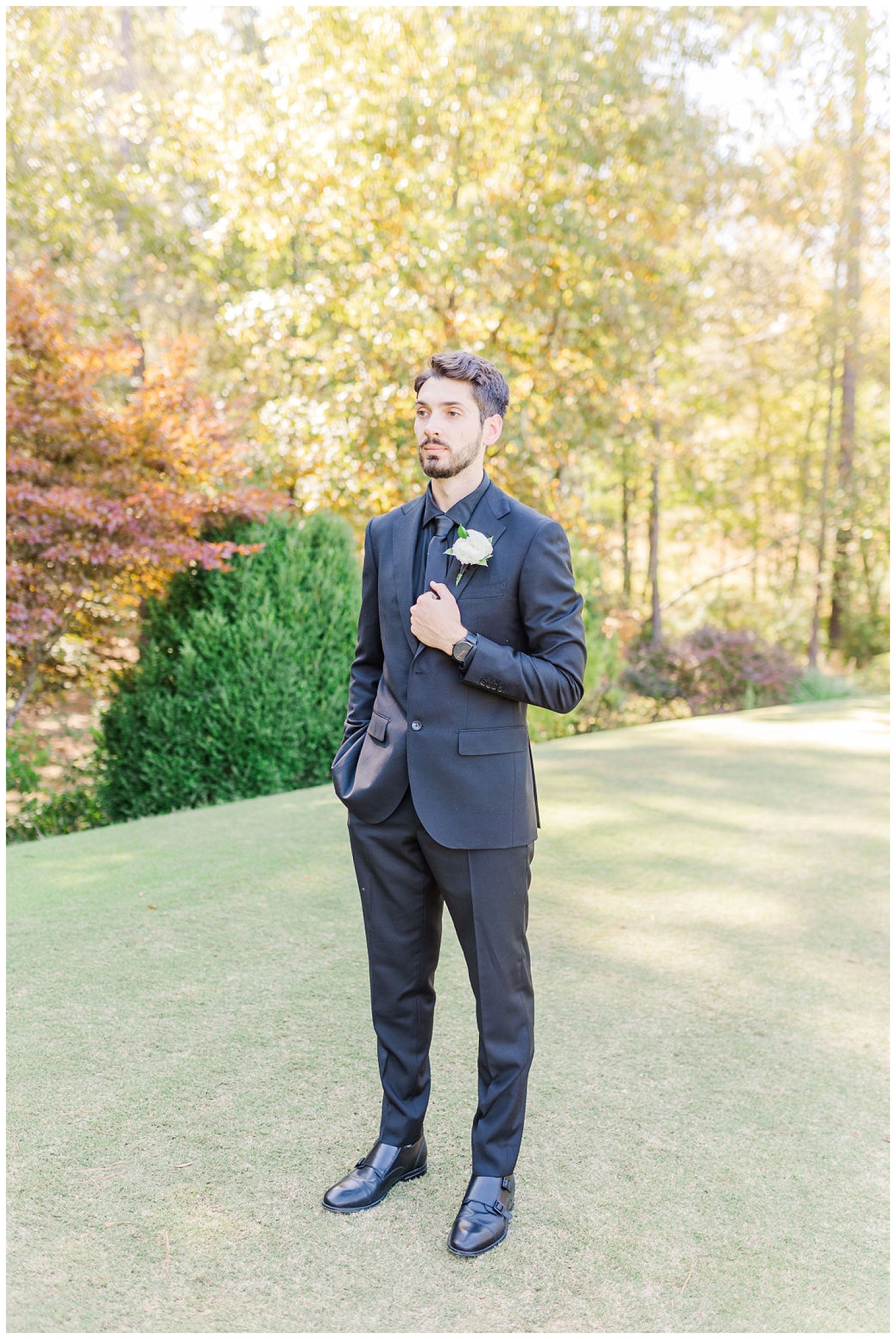 groom posing for portraits in Chapel Hill