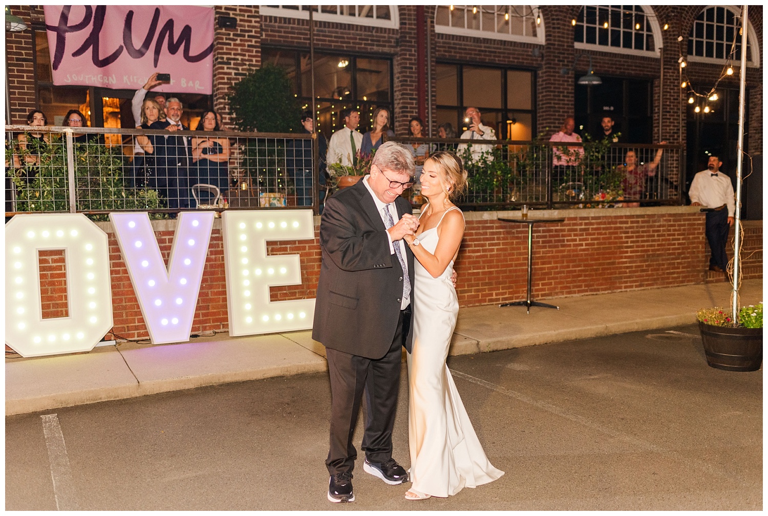 bride dancing with her dad at the Plum Kitchen in Durham