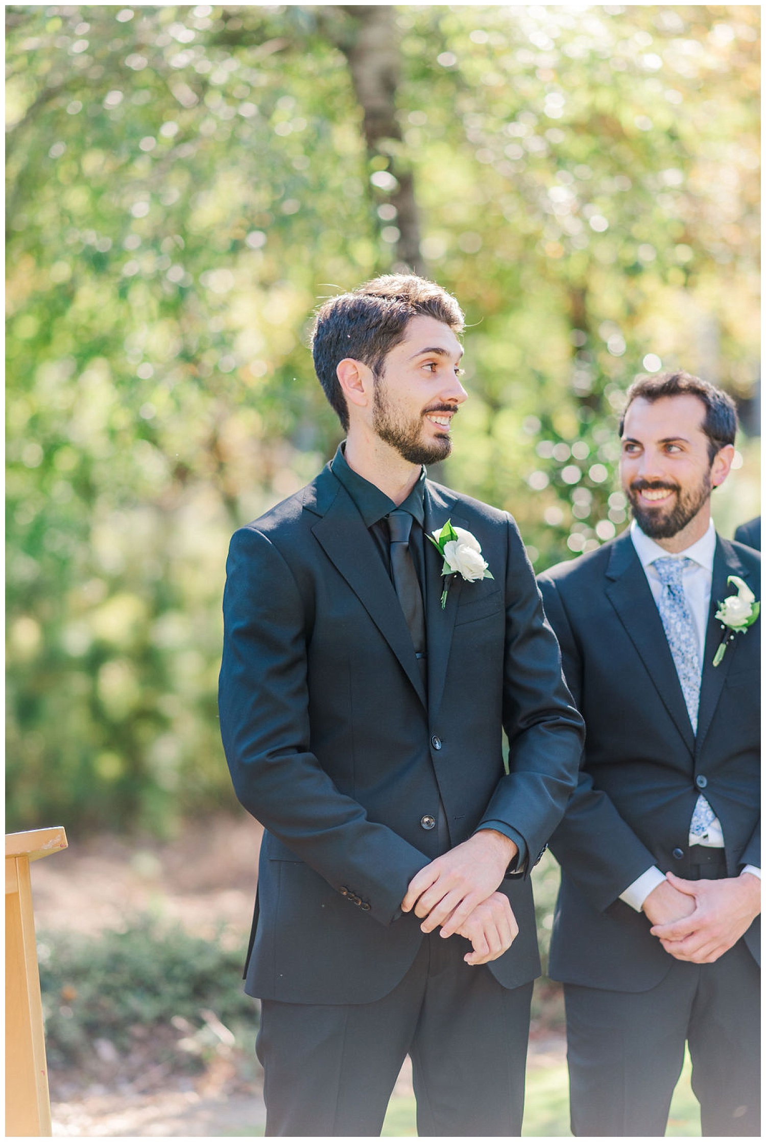 groom smiling at the wedding ceremony at Chapel Hill Carriage House