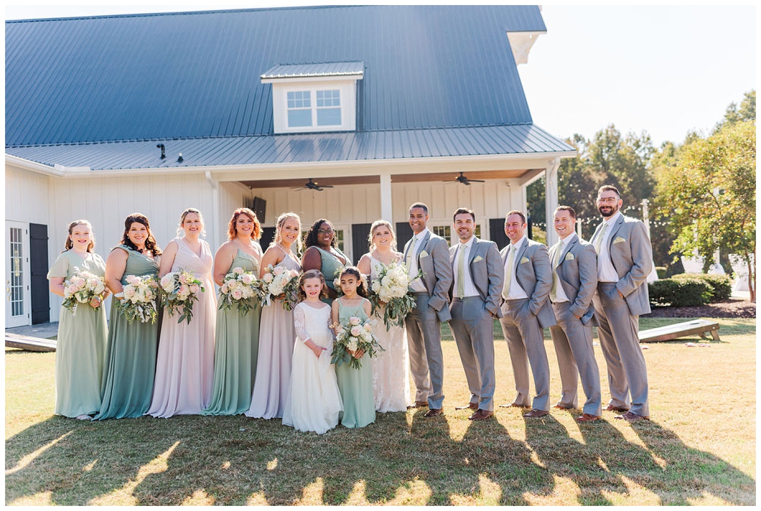 full bridal party posing at The Carolina Barn