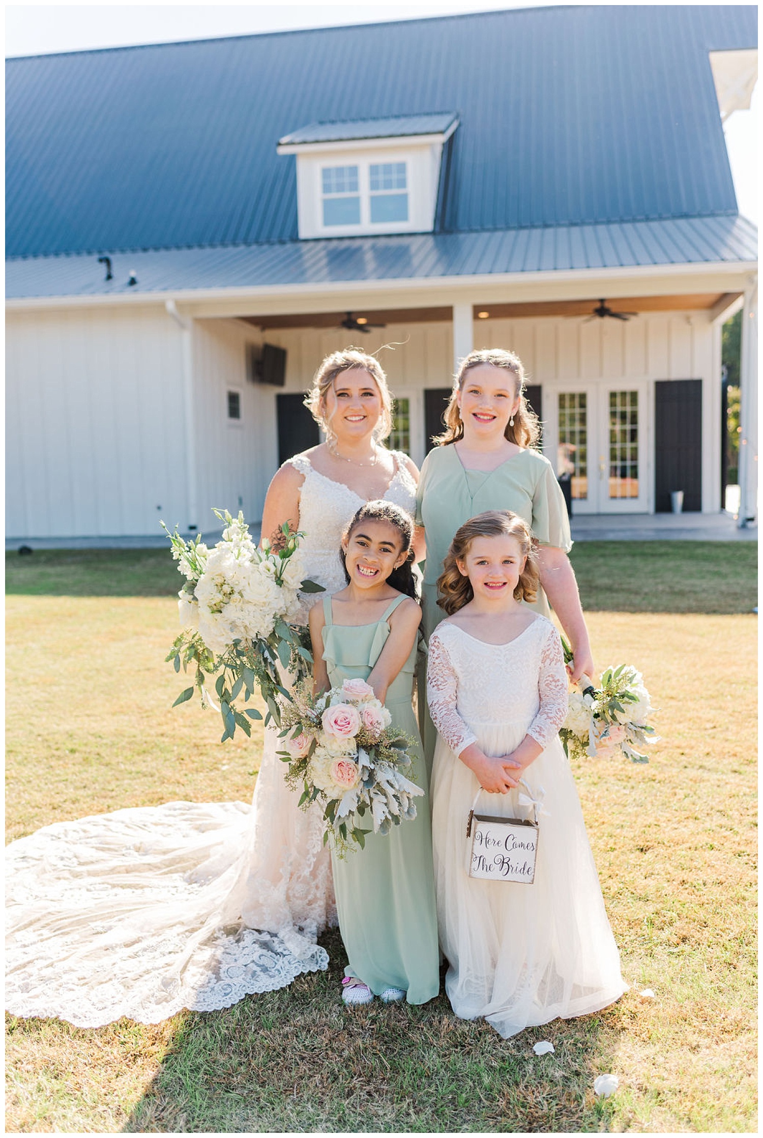 bride posing with flower girls