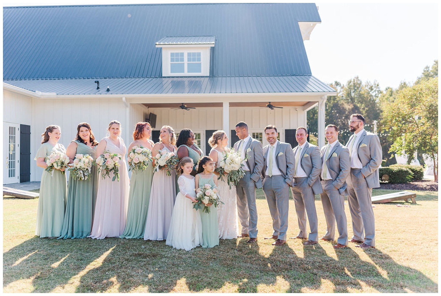full bridal party posing together at North Carolina wedding