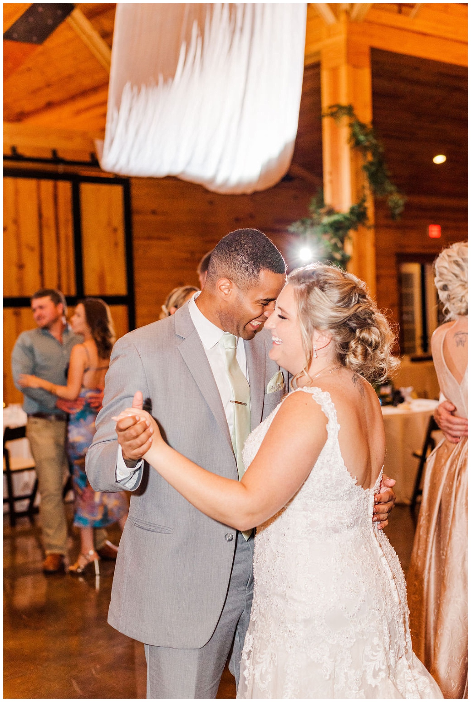 bride and groom dancing at reception at The Carolina Barn