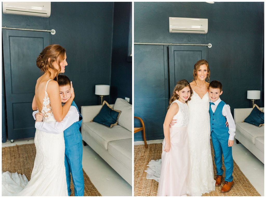 bride hugging both her son and daughter before wedding ceremony