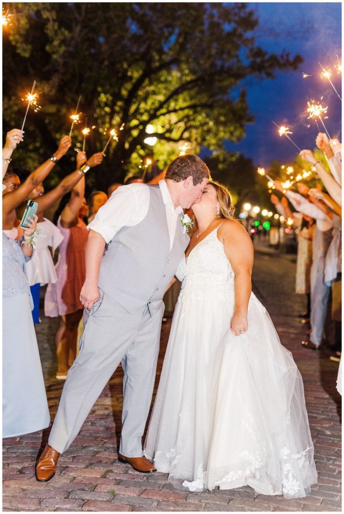 bride and groom exiting their reception with sparklers at the River Room
