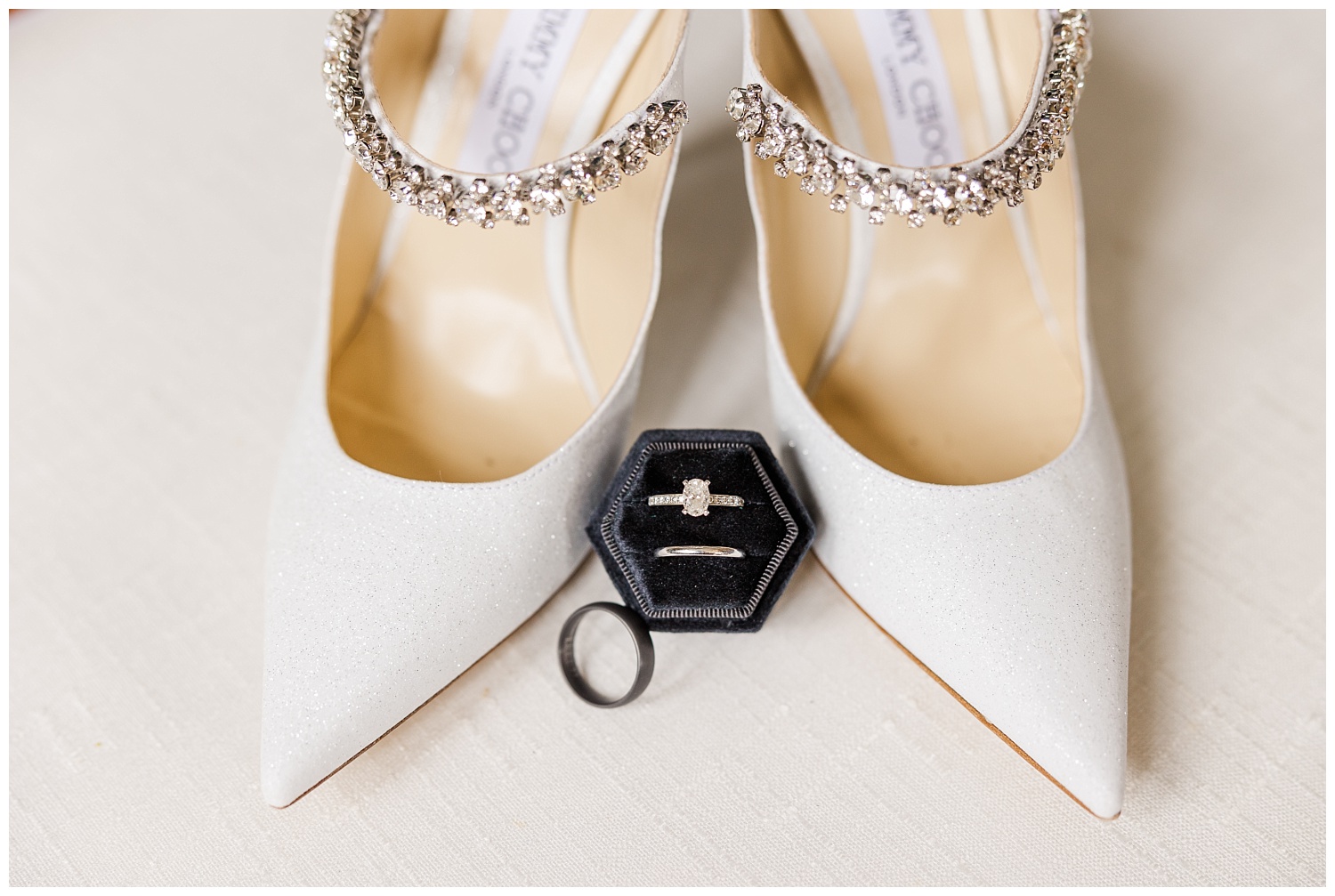 white wedding shoes next to rings at Wilmington winter ceremony