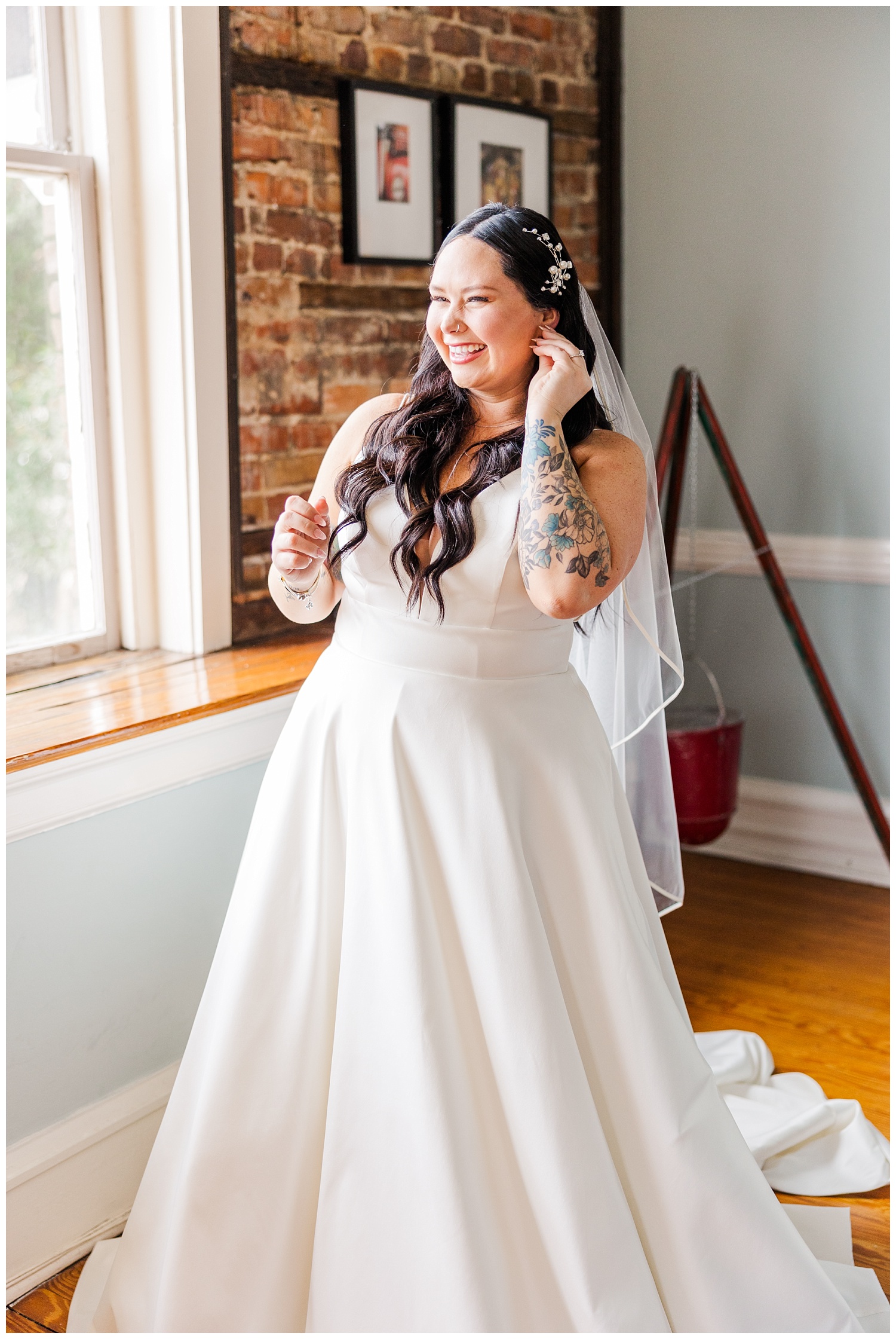 bride putting on earrings at Station No.2 in Wilimington