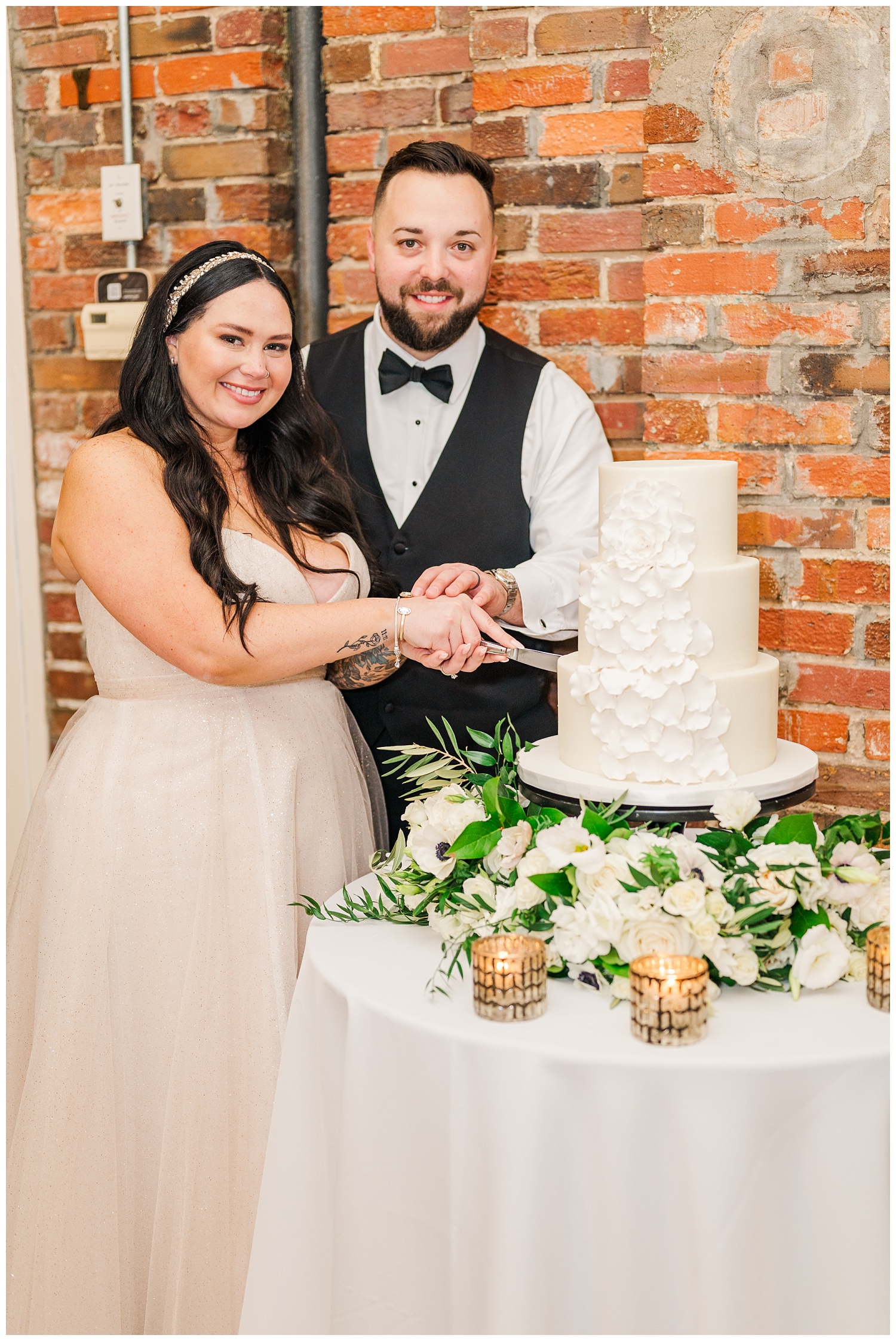 bride and groom cutting cake at winter wedding in Wilmington