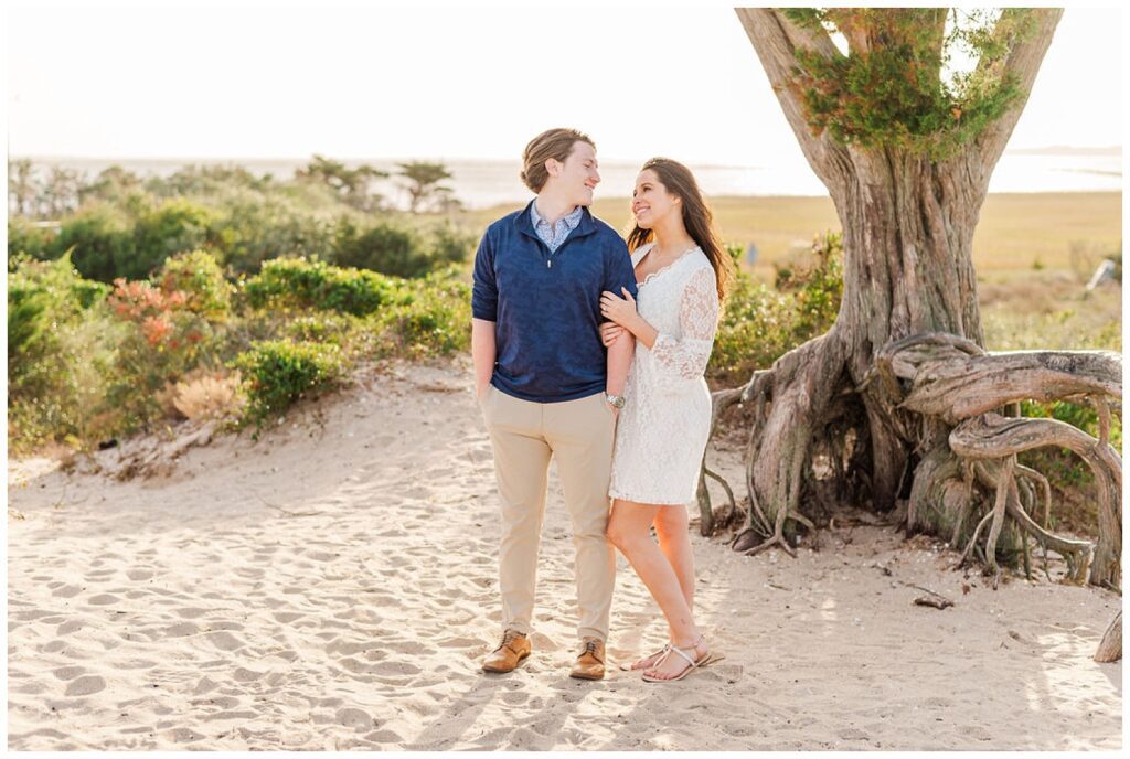couple posing for beach engagement pictures at Fort Fisher