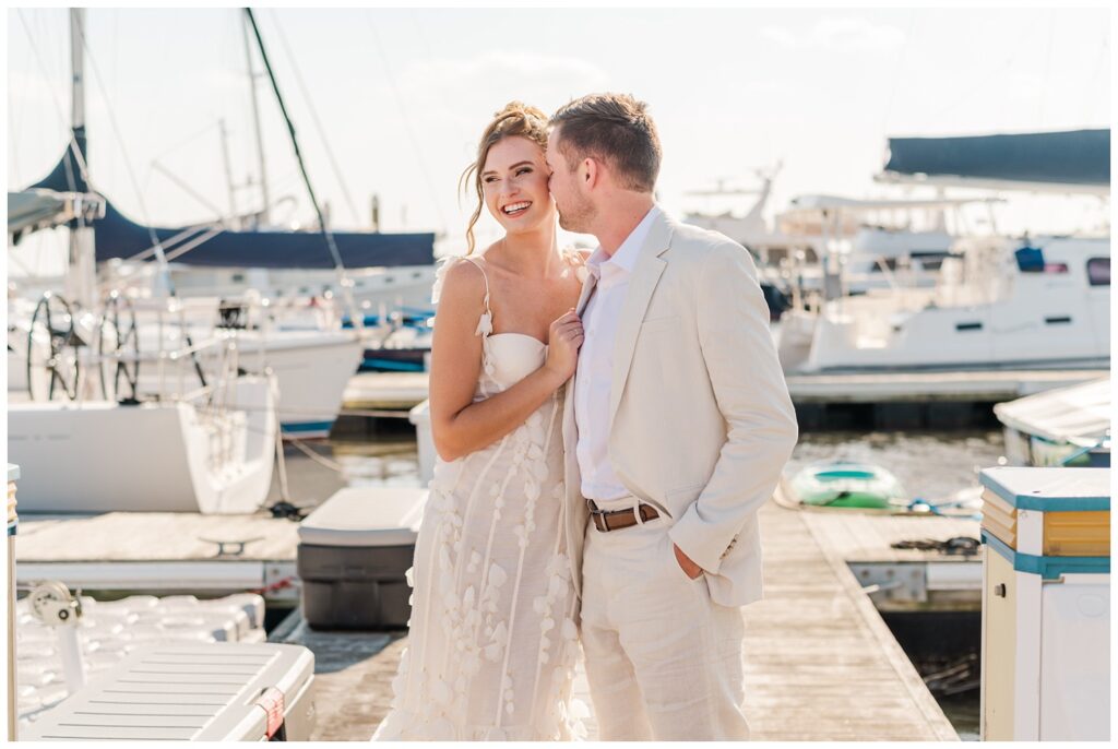 couple posing for elopement photos at Charleston Harbor