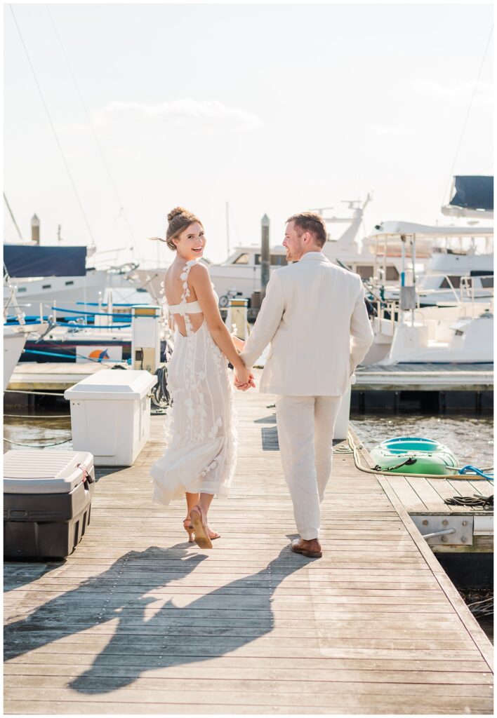 couple walking on the dock at Charleston Harbor