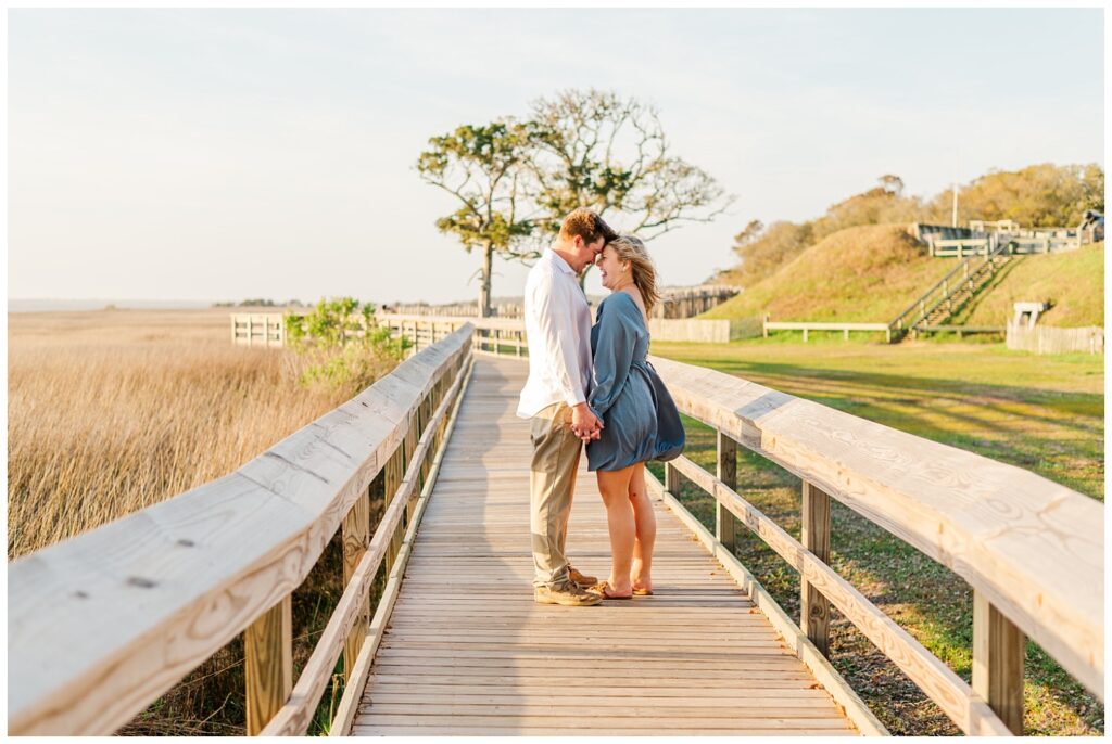 engagement session on the walkway at Fort Fisher