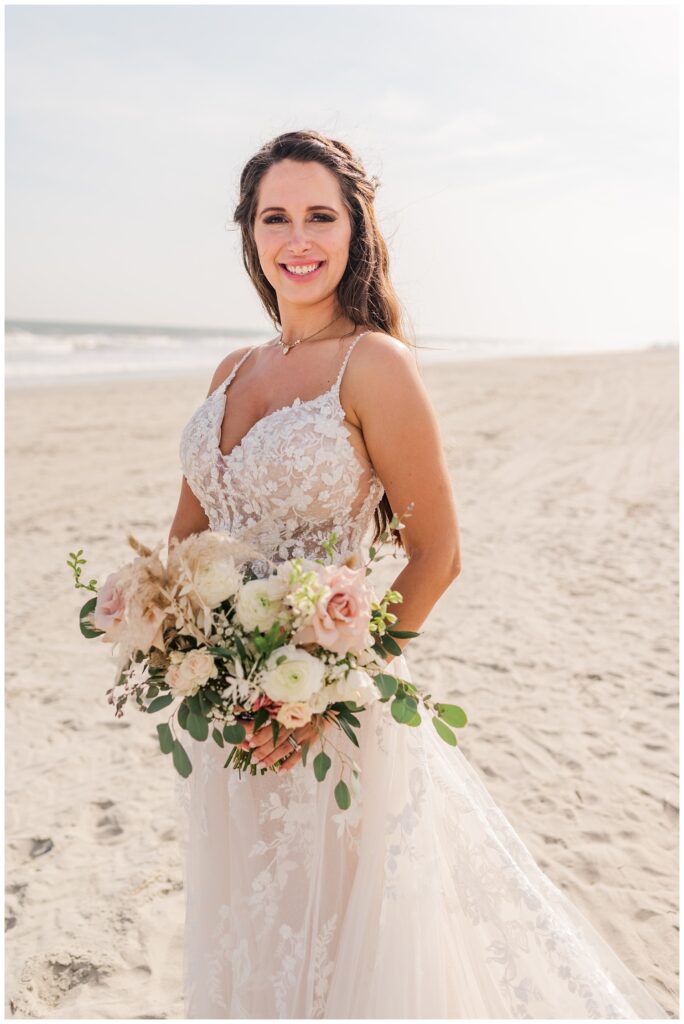 bride standing on the beach in Ocean Isle, NC