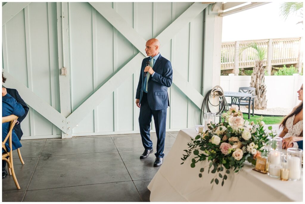 bride's dad giving speech at Ocean Isle wedding wedding reception