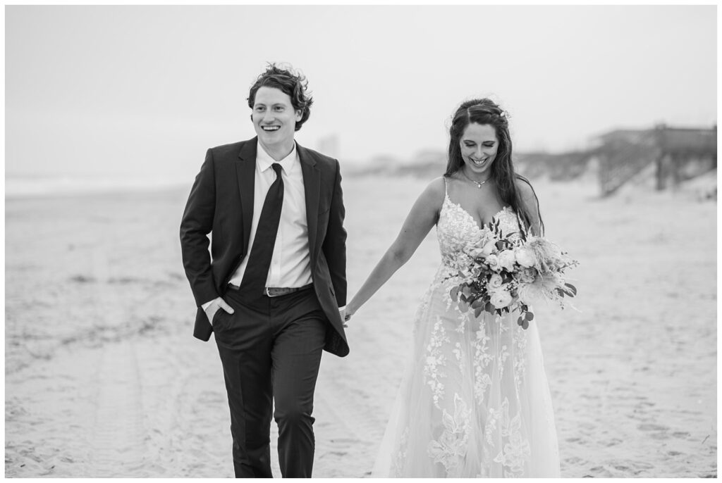 bride and groom laughing at NC beach wedding