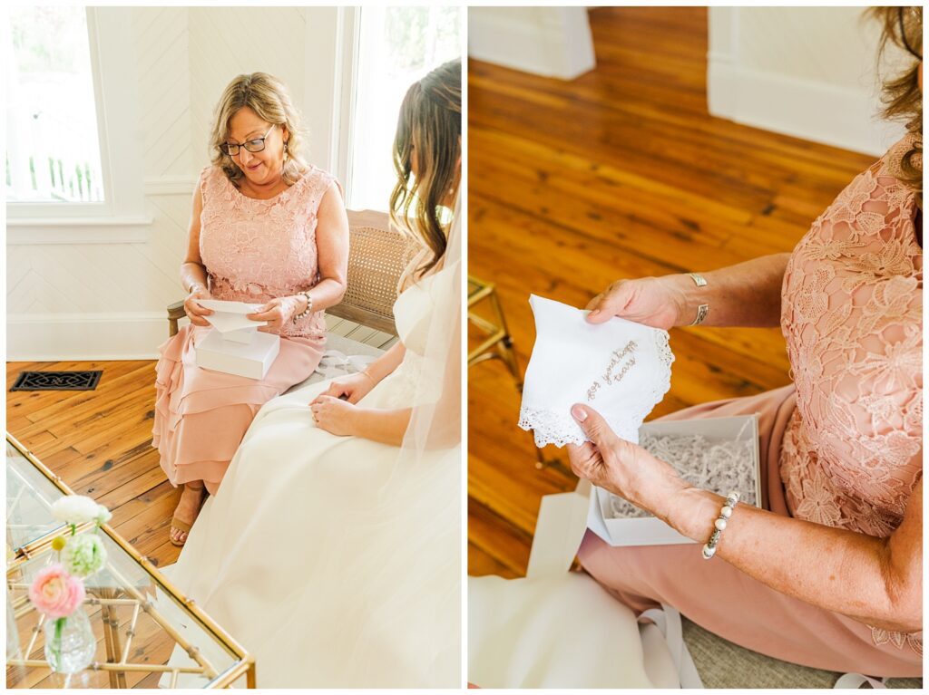 mom opening gift from bride while sitting on a couch in North Carolina