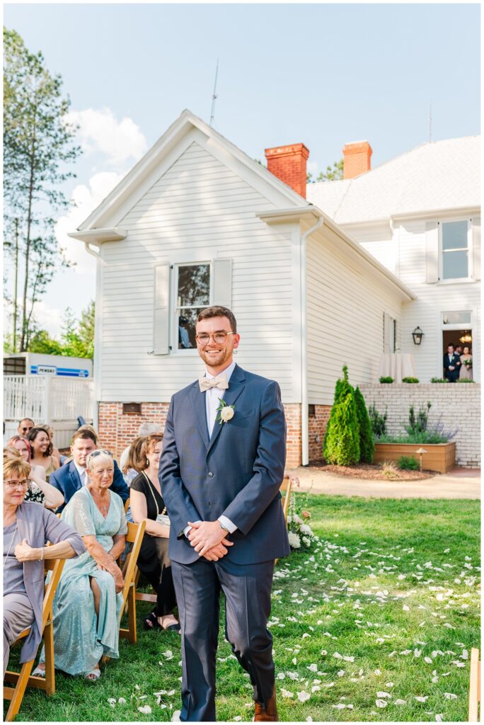 groom walking down the aisle at outdoor ceremony in Apex, NC
