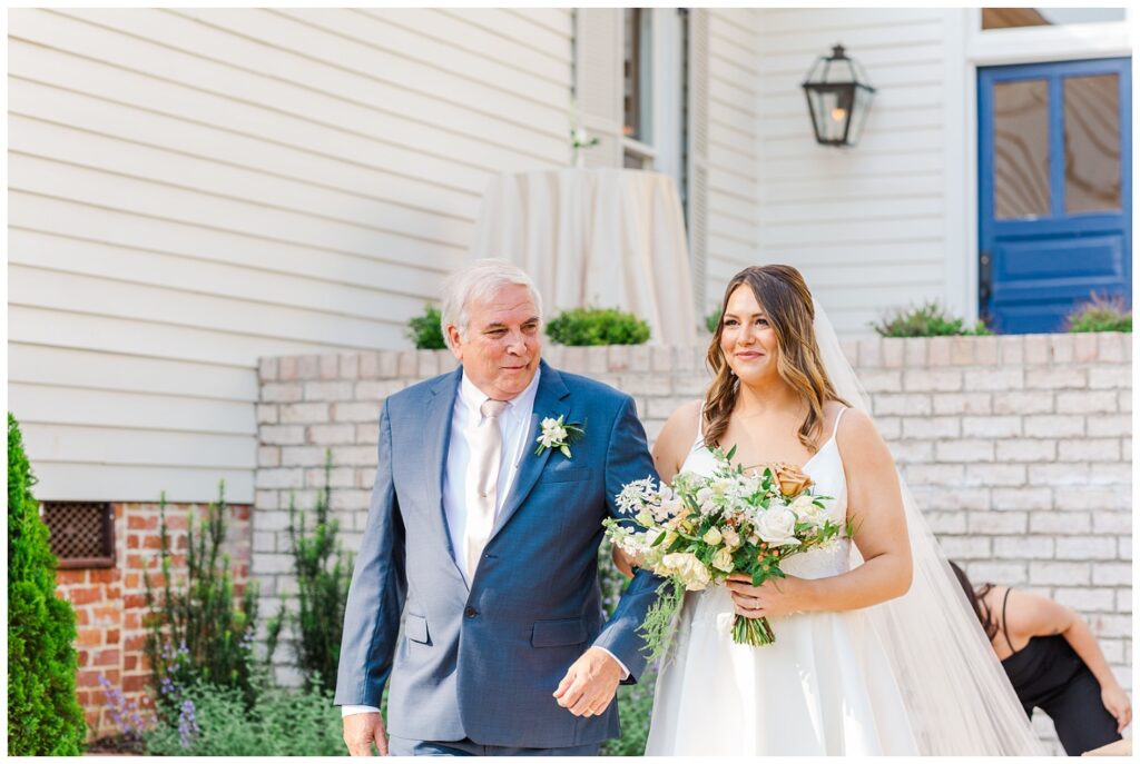 bride walking down the aisle with her dad at outdoor ceremony in North Carolina