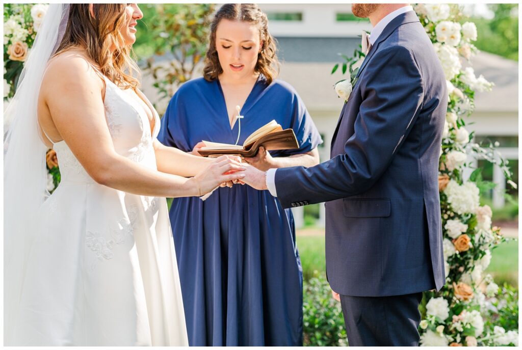 wedding couple exchanging rings at the Upchurch venue in North Carolina