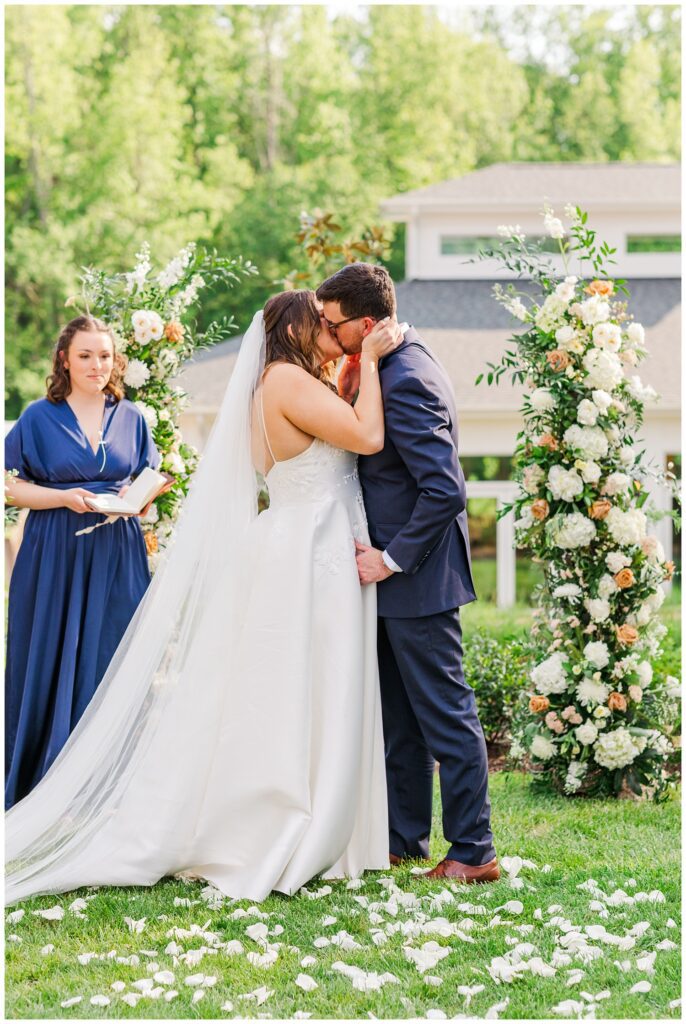 bride and groom kiss at spring wedding in Apex, NC