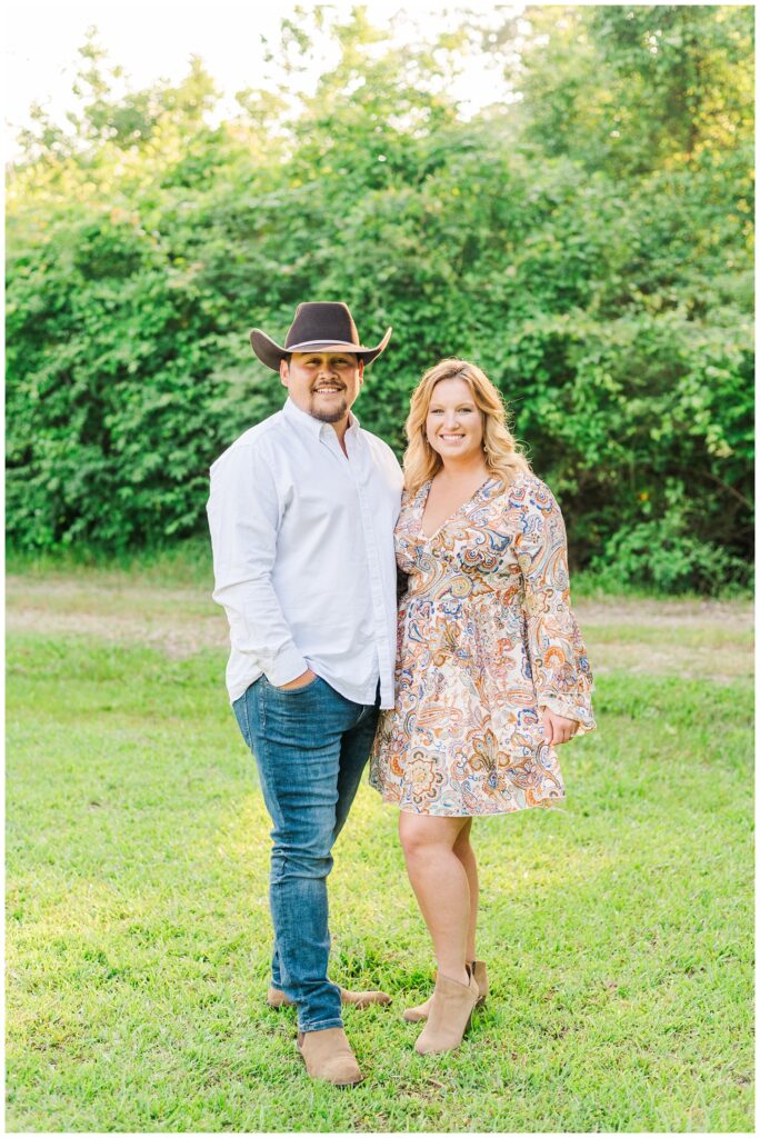 couple posing on a farm in Fayetteville, NC
