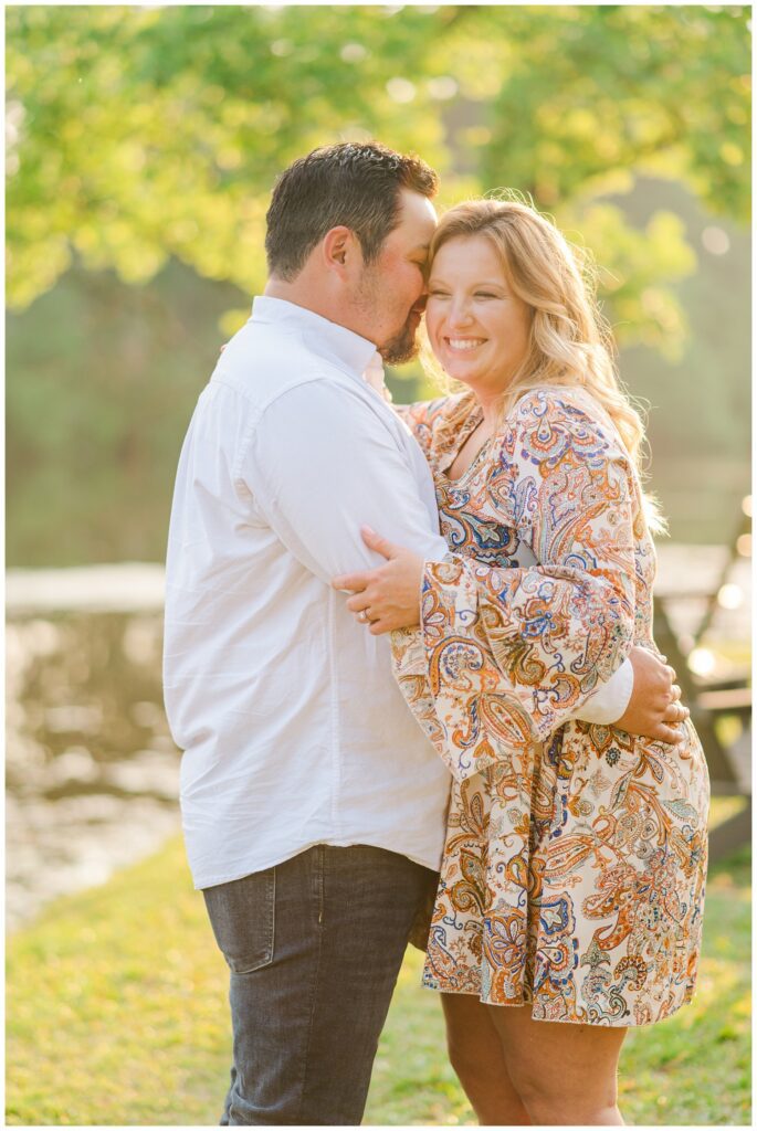 couple laughing at spring engagement session in Fayetteville