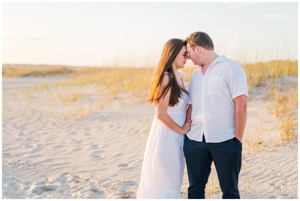 couple posing on the beach on the coast of North Carolina