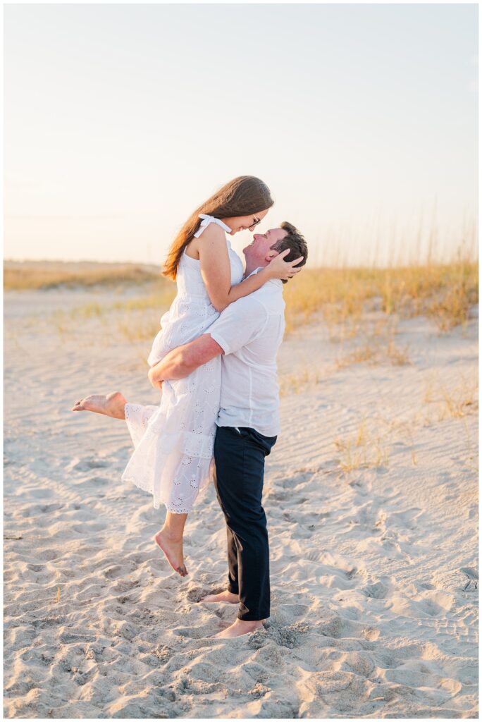 couple posing on the beach on the coast of North Carolina