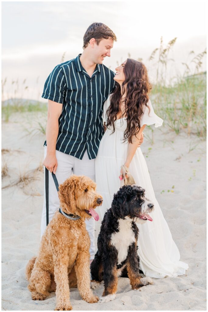 engagement session with two dogs on the beach in Wilmington