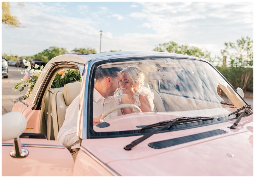 engaged couple sitting in a pink car in Charleston for styled session