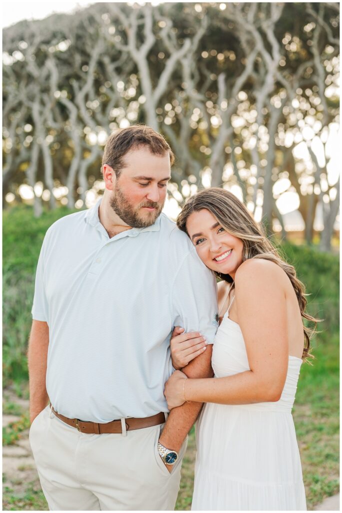 couple posing together on the beach at Fort Fisher engagement shoot