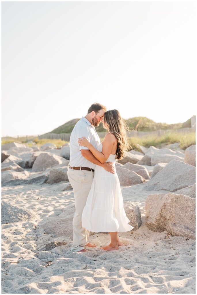 couple touching foreheads on the beach at Fort Fisher, North Carolina