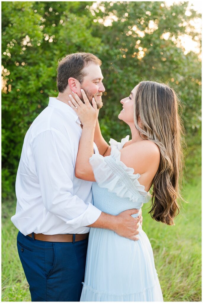 woman wearing light blue dress at Fort Fisher engagement session