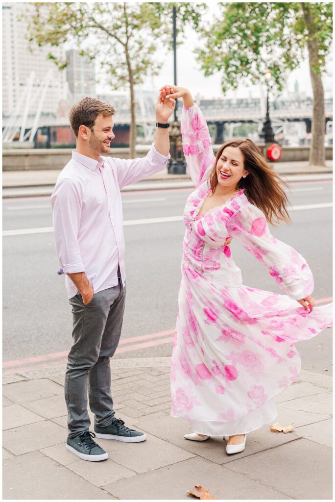 couple dancing on the streets of London for summer destination engagement session