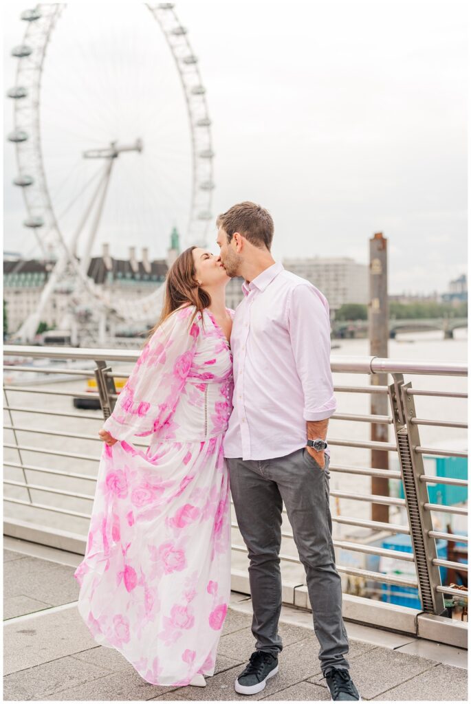 couple sharing a kiss on the River Thames in London